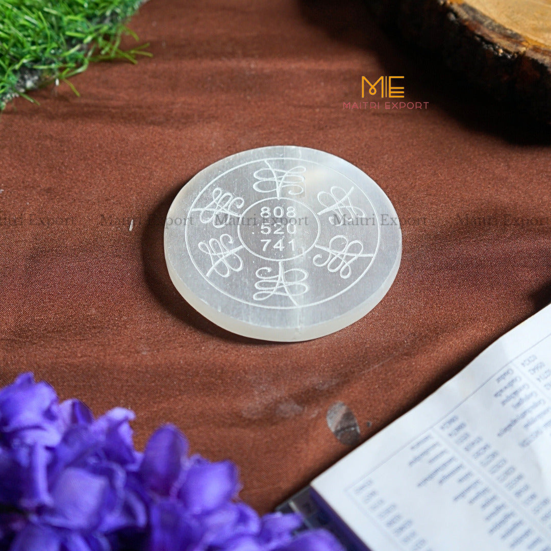 Natural selenite plate with different carvings-Round-Zibu symbol for Money-Maitri Export | Crystals Store